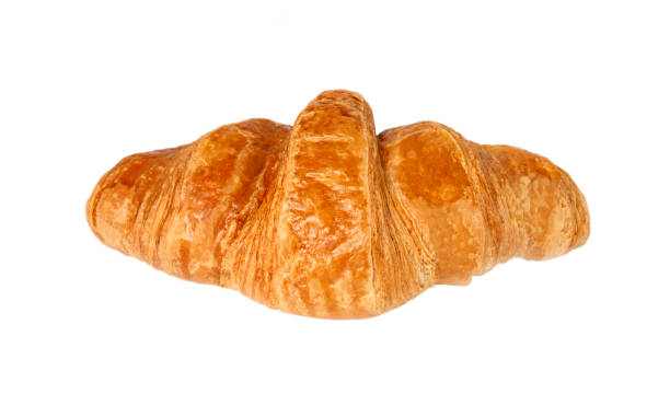 istock One fresh croissant isolated on a white background. 1344473626