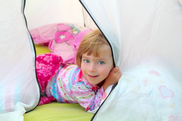 istock girl in camping tent lying on camp tent 1344476576