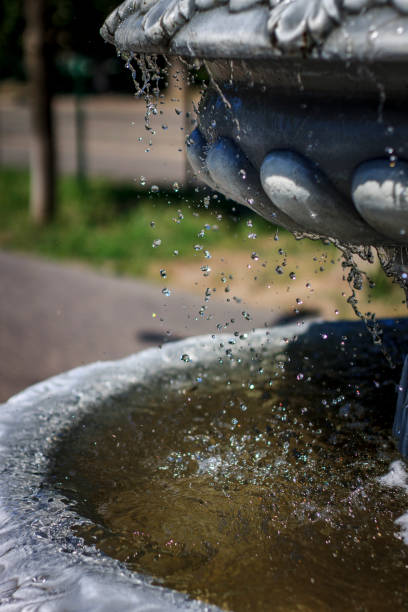 istock Artificial fountain calmly flowing drops on a sunny day 1344476887