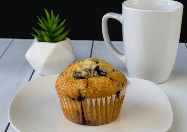 istock blueberry muffin with a cup of coffee 1344478543