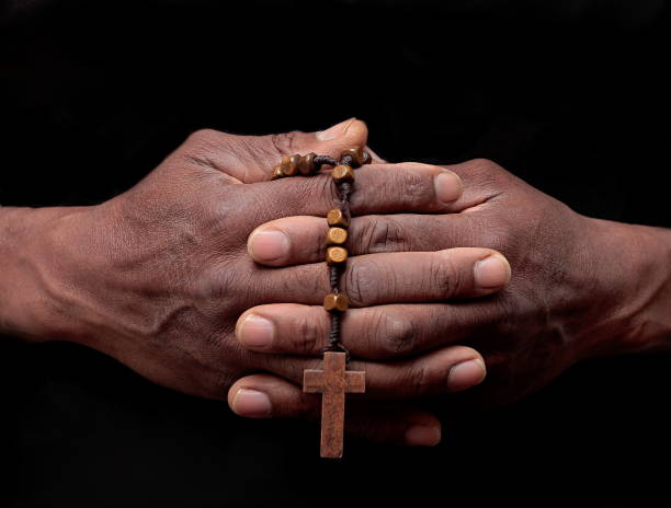 istock man praying with  hands stock photo 1344478601