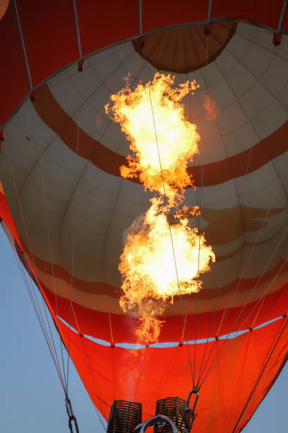 istock Hot air balloon being inflated by fire 1344478958