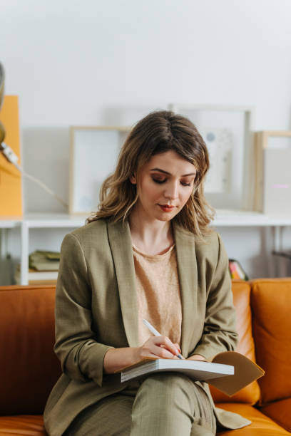 istock Beautiful Businesswoman Writing Notes in the Office 1344481494