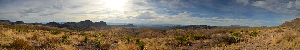 Panoramic of the Chisos Mountains in Big Bend National Park near Terlingua, Texas. This photo was taken at the trailhead of the balanced rock hike￼