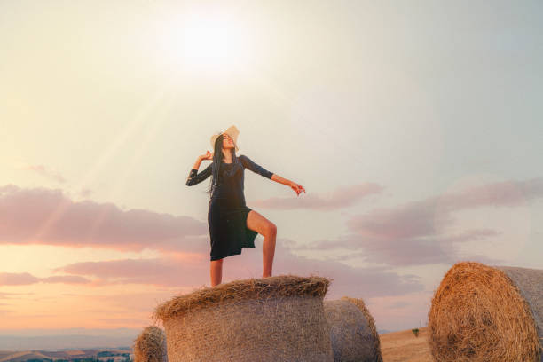 istock Young women and agriculture bale. 1344483632