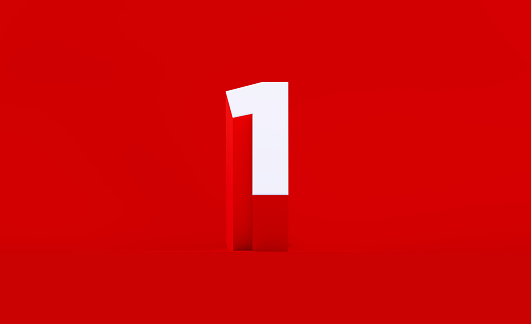 White number one sitting on red background. Horizontal composition with copy space.