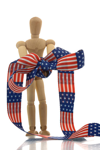 istock Manikin hands tied with us banner tape 134448710