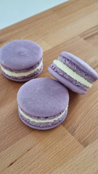 istock Violet macarons on wooden table 1344496906