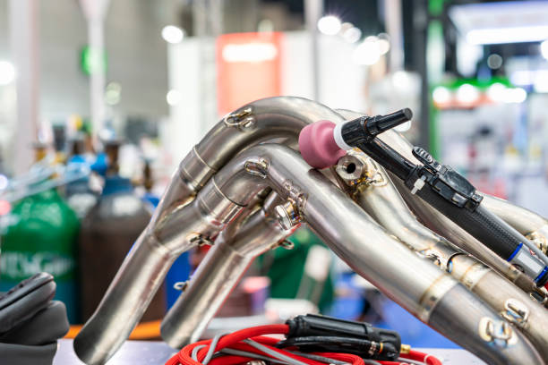 istock Stainless steel pipe automobile or motorcycle part after assembly component by Tungsten inert gas or tig welding process with welding torch 1344497575