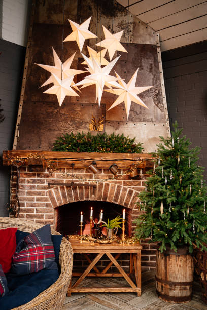 istock fireplace and house decorated with Christmas tree, garland and wreath. 1344500943