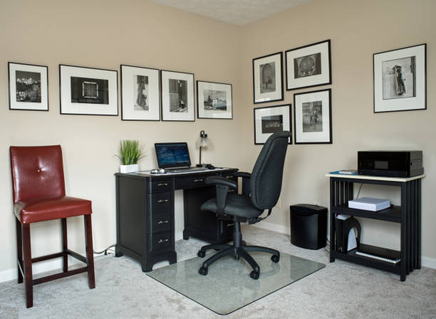 Home Office in Black and White Theme Home office with black furniture, B&W framed photographs & burgundy bar stool. home office photos stock pictures, royalty-free photos & images