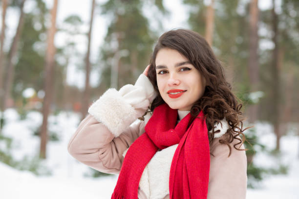 istock Adorable lady posing in snowy winter 1344504986