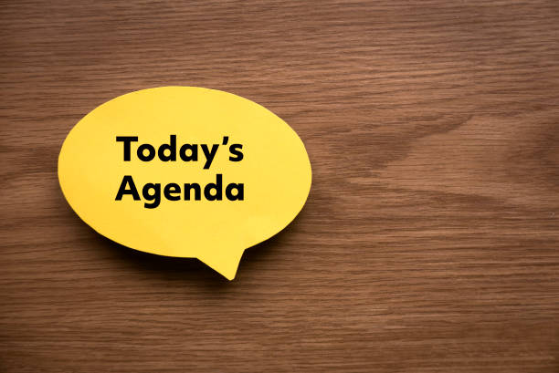 top view of yellow speech bubble written with today's agenda on wooden background with copy space. - personal organizer imagens e fotografias de stock