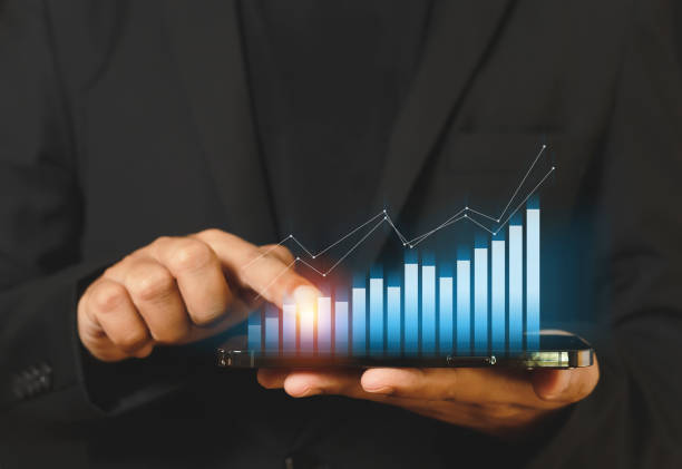istock businessman touching smartphone screen with trading graph. stock exchange marketing analyzing chart. information statistics diagram profit. investment and marketing concept. 1344524979