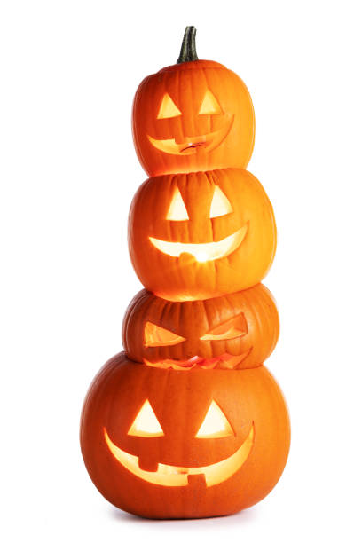 Stack of glowing Halloween Pumpkins Stack of glowing Halloween Pumpkins isolated on white background halloween pumpkin decorations stock pictures, royalty-free photos & images