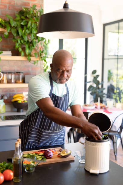 istock Serious african american senior man cooking in kitchen 1344526029