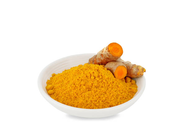 Turmeric roots with turmeric powder on white Turmeric roots with turmeric powder on white background,Used for cooking and as herbal medicine finely stock pictures, royalty-free photos & images