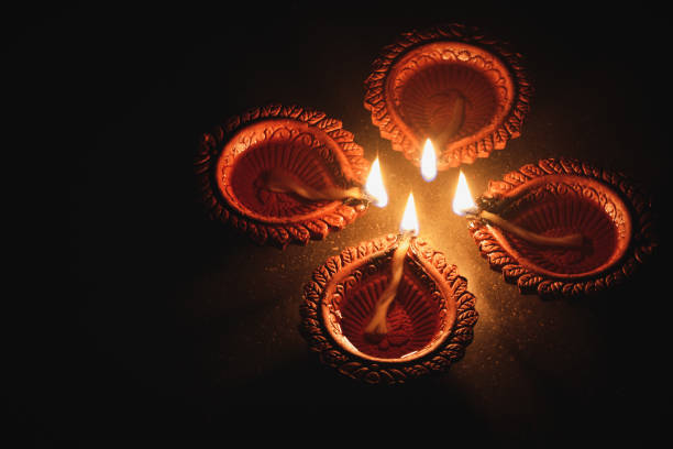 istock Clay diya lamps lit during Diwali Celebration 1344531741