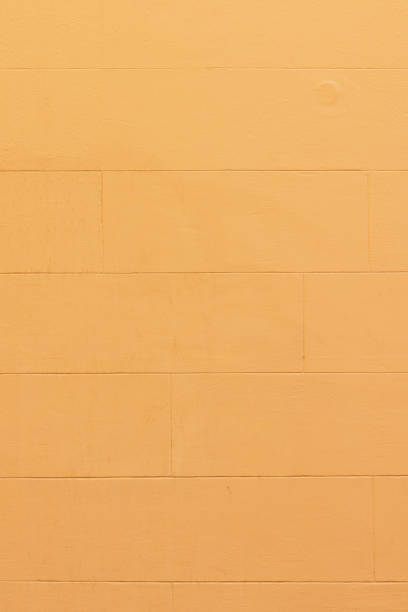 istock Part of a yellow colored concrete wall 1344535203