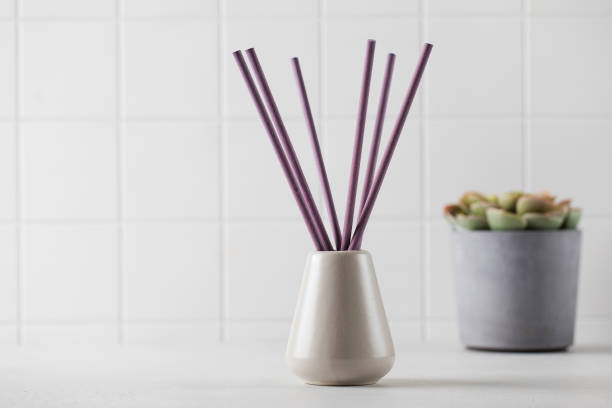 vase and incense sticks. interior perfume concept. copy space. - aromatic oil burner imagens e fotografias de stock