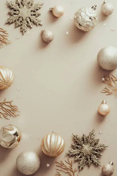 Photo of Elegant Christmas background with golden balls decoration, snowflakes. Stylish Christmas card design.