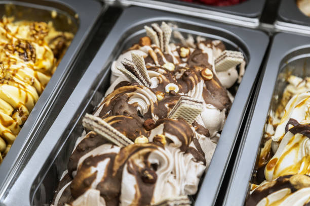 istock ice cream with different flavors, in trays in the refrigerator 1344537325