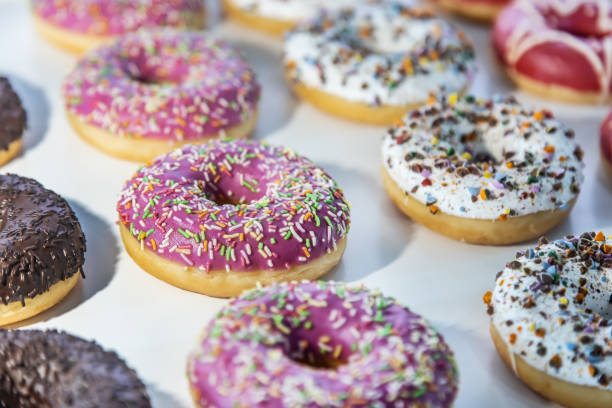 istock donuts with different flavors, fillings and different sprinkles 1344537343