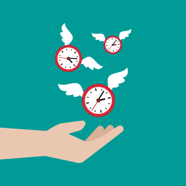 istock Hand catches flying clock with wings. Hunt, chase time. Achieve goals, financial success, business income concept. 1344537394