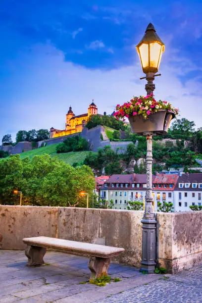 Wurzburg, Germany. Alte Mainbrucke (Old Main Bridge) and beautiful medieval  Marienberg castle, touristic attraction in Bavaria.