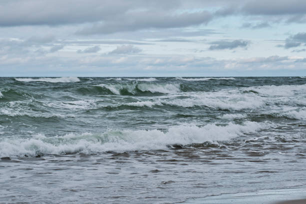 istock Beautiful seascape with big waves, dramatic cloudy sky 1344543147