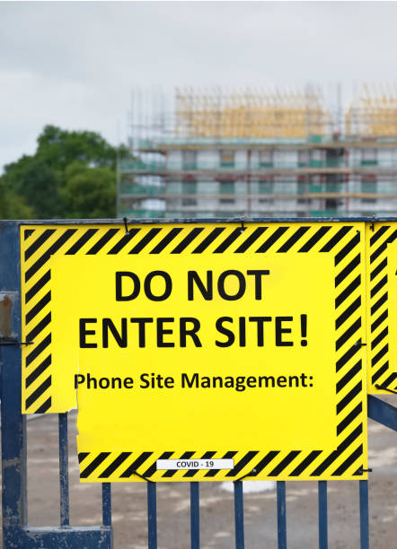istock Do not enter construction in progress sign on fence 1344543320