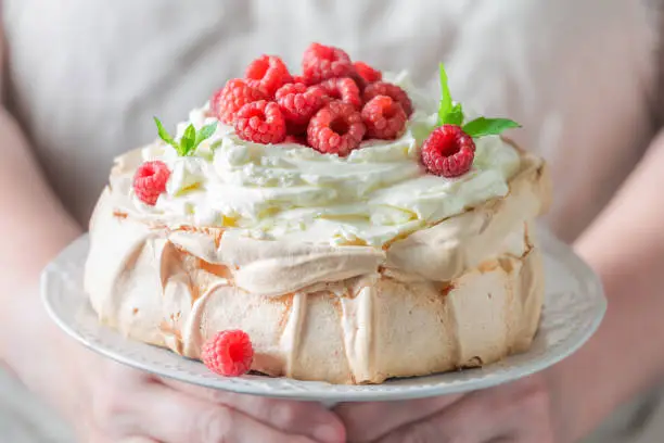 Photo of Tasty Pavlova cake with raspberries and mascarpone.