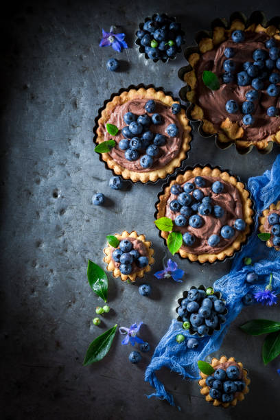istock Delicious mini tart with berries and mascarpone cheese. 1344548144