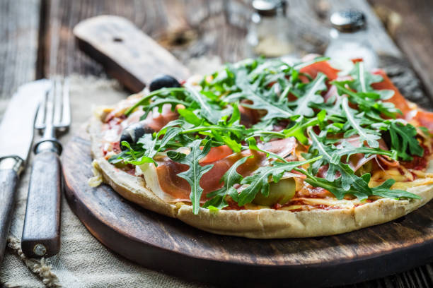 istock Tasty pizza with tomatoes and basil. Pizza with mozzarella. 1344548557