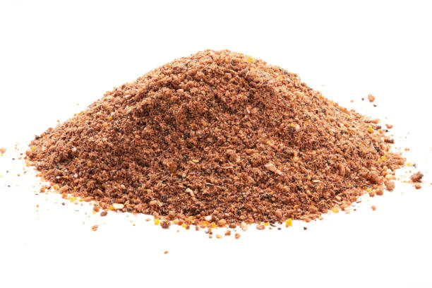 Pile of Nutmeg powder isolated on white background. stock photo