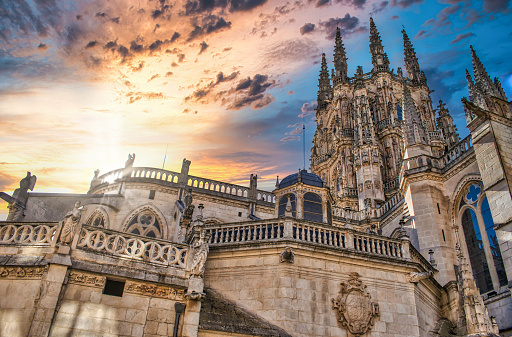 Sun looming above the Gothic cathedral of Burgos, Spain