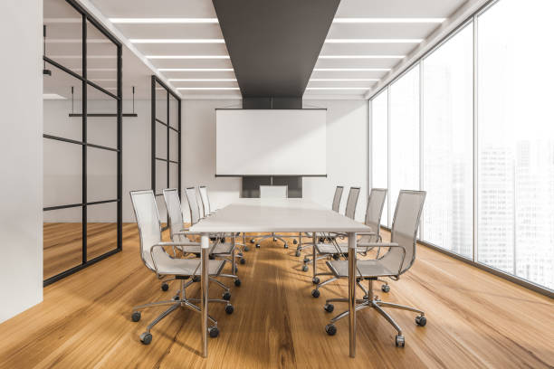 istock Black and white panoramic meeting room with white board 1344550342