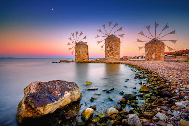 istock Old windmills by the beach, Chios island, Greece. 1344550798