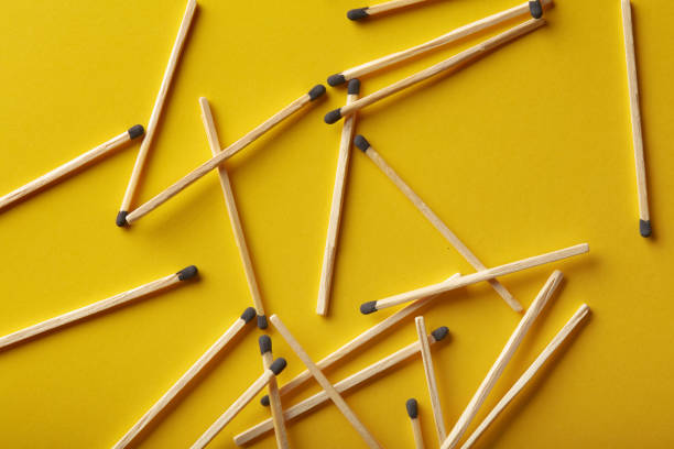 istock Matches on a yellow background, an abstraction about teamwork and modern relationships 1344555064