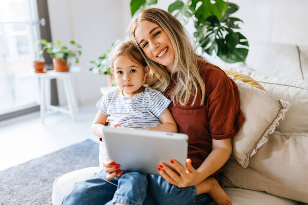 istock Mother and daughter using a digital tablet together 1344564187