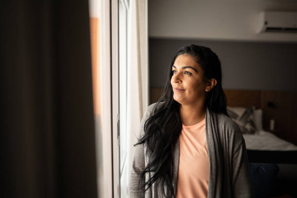istock Woman contemplating at home 1344565783