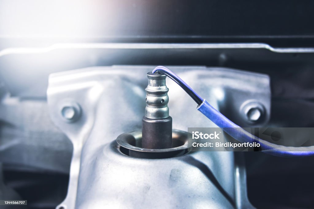 Oxygen sensor O2 on the header exhaust pipe Oxygen sensor O2 on the header exhaust pipe for calculate mixing of engine ignition system in the car Sensor Stock Photo