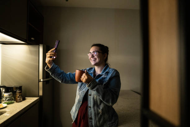istock Young woman on a video call at home 1344566939