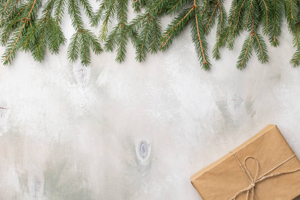 istock Table with Christmas composition with gift, decorations, fir tree branches on wooden background. Flat lay, top view 1344567664