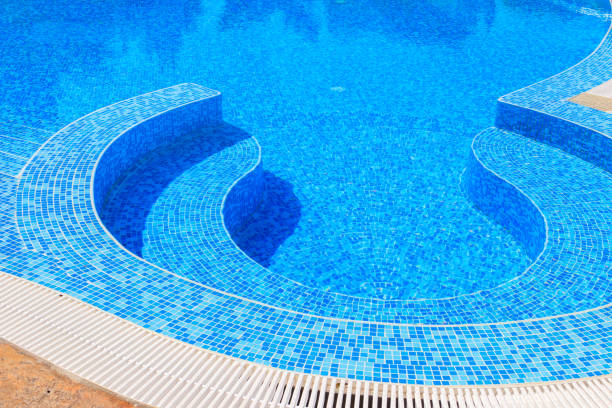 istock Swimming pool with clear water at a tropical resort 1344567802