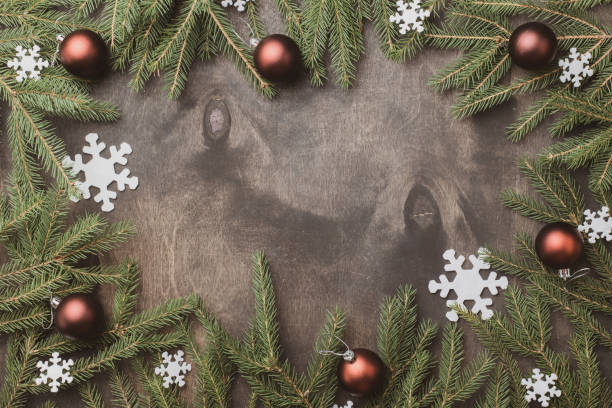 istock Table with Christmas composition with gift, decorations, fir tree branches on wooden background. Flat lay, top view 1344569088