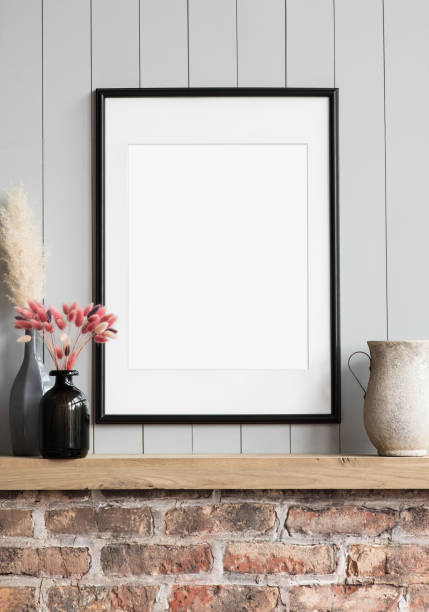 istock Artwork mock-up in interior design. Blank white picture frame on a gray wall 1344569959