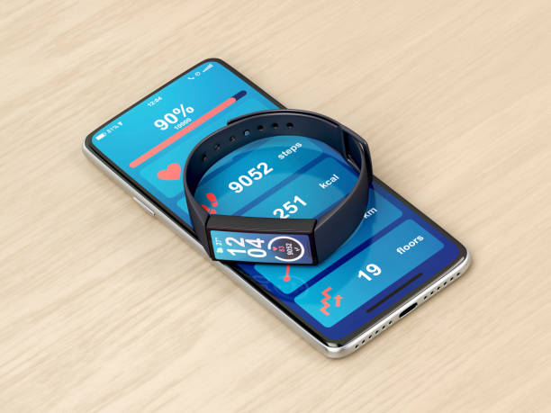 Smartphone and fitness tracker Smartphone and fitness tracker on wooden desk pedometer photos stock pictures, royalty-free photos & images