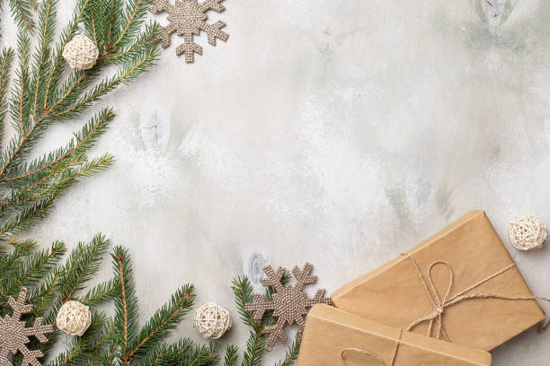 istock Table with Christmas composition with gift, decorations, fir tree branches on wooden background. Flat lay, top view 1344570993