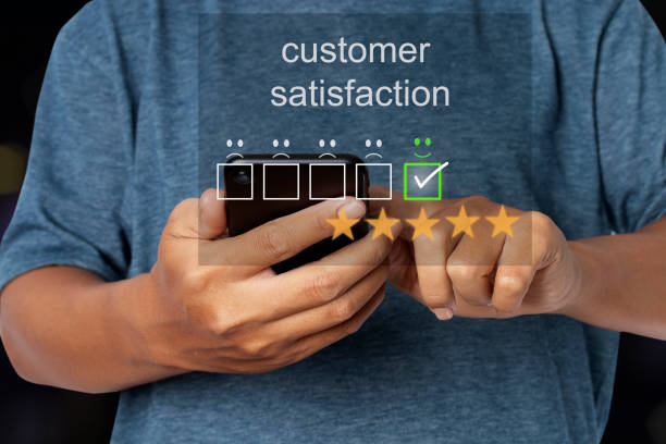 istock Young man using smartphone with virtual screen on the smiley face icon on the digital touch screen. 1344573842